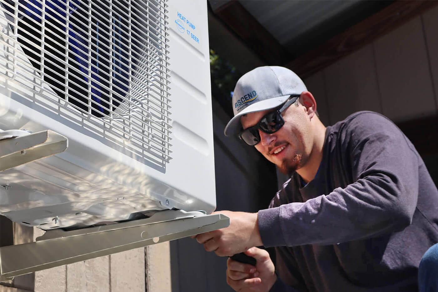 HVAC professional repairing residential HVAC equipment.